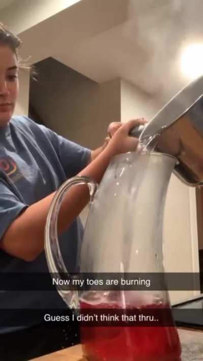 Pouring boiling hot water into a glass mug
