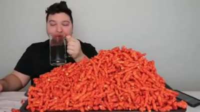nickocado avocado eating 5 family sized bags of hot cheetos