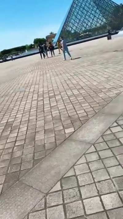 HMC going surfing on a friend's shoulder while she is on a scooter