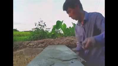 Man creates his own power generation resource by constructing a dam on a wastewater flowway.