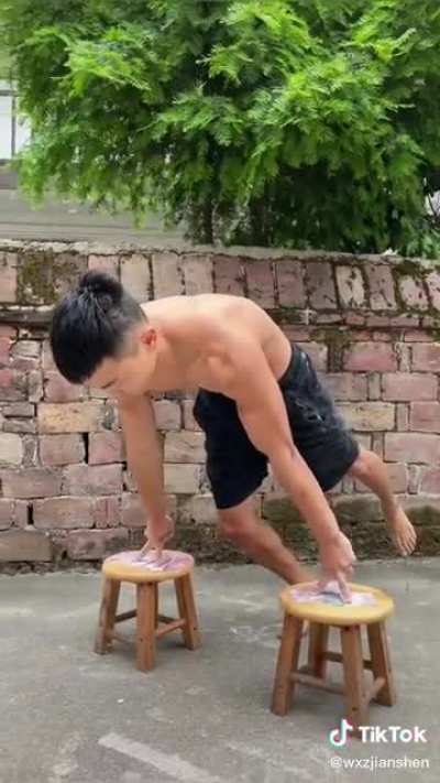 Two-finger planche pushups on stools