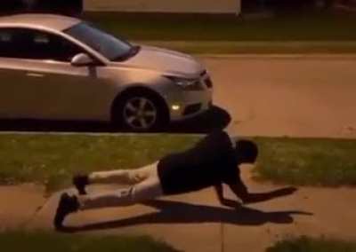 Man does a full frontal flip from an incline plank position