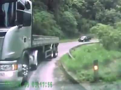 Dangerous truck overtake attempt going down a tight mountainous road