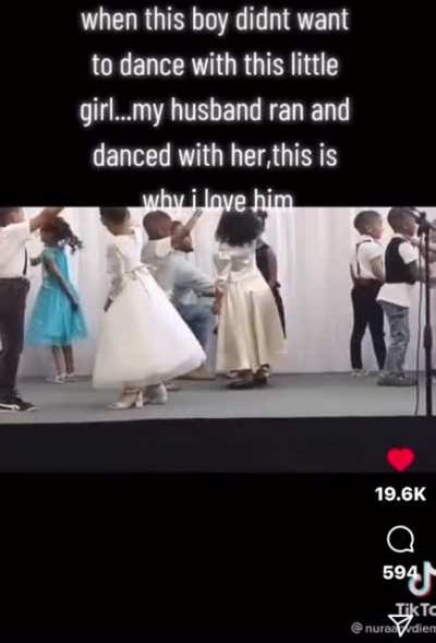 Man dances with young girl so she wouldn’t be left out during recital.