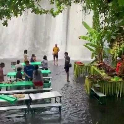 A restaurant at the foot of a waterfall in the Philippines