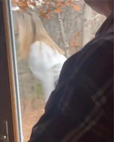 Father watching her daughter record a tiktok video