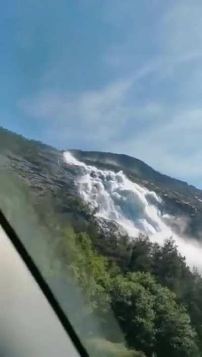 ? Langfossen Waterfall in Norway thunders right past the roadside