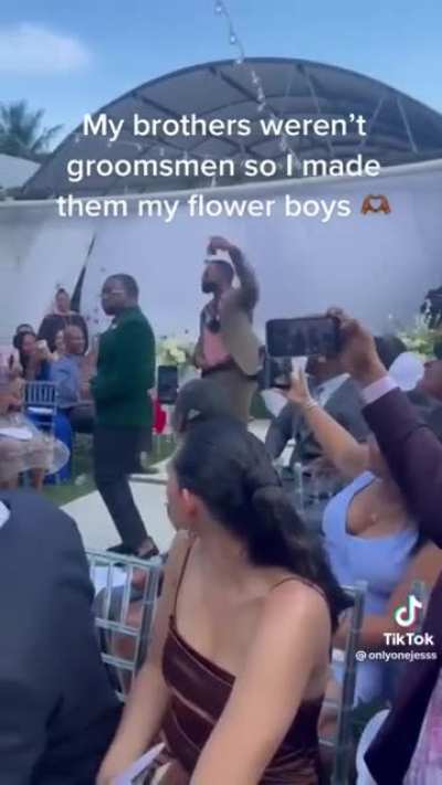 Brothers weren't groomsmen so she made them Flower Boys ?