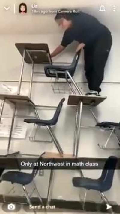 Climbing on top of a tower of desks