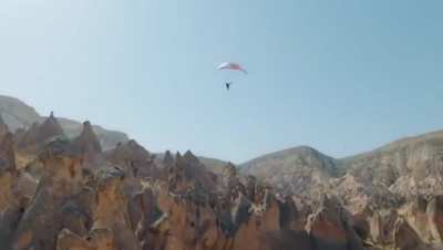 ? French athlete Valentin Delluc paragliding over breathtaking Capadocia, Turkiye