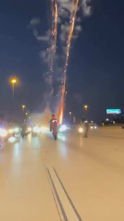 Launching fireworks from a motorcycle on an active highway
