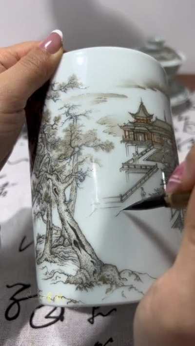 Traditional hand-painted art on a porcelain teacup