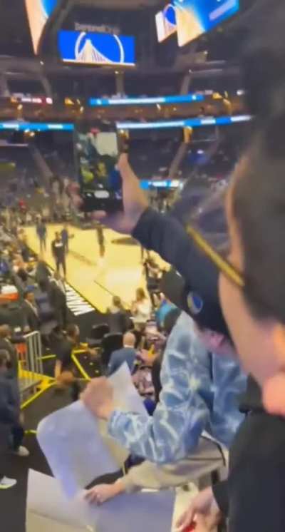 Golden State Warriors legend Steph Curry hits a full court shot from the tunnel.