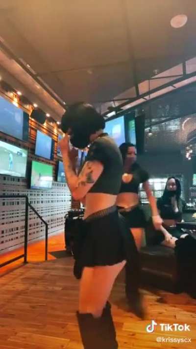 A Hostess Shows Off Her Mask With A Dance