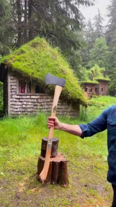 This man showing his various axe designs.