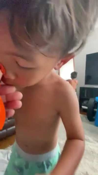My nephew trying to blow a balloon?
