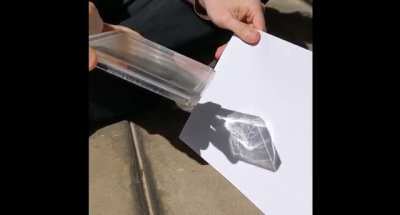 Hiding Images in Plain Sight: The Physics Of Magic Windows