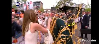 To shoot streamers into a crowd without completely covering princess Amalia of the Netherlands.