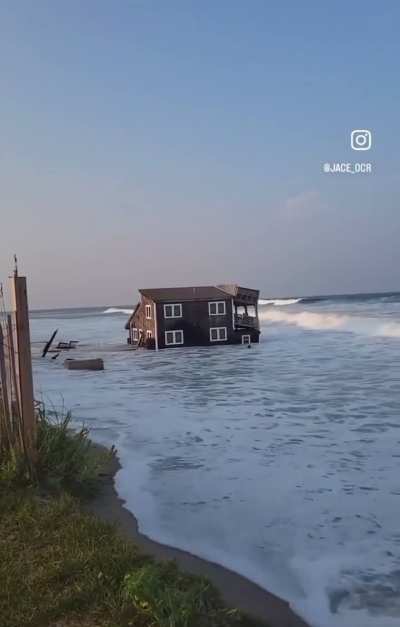 House in Cape Hatteras, NC collapses from the force of waves generated by a hurricane 300 miles away