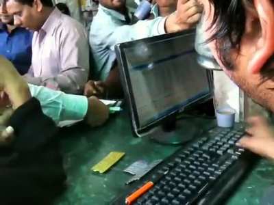 This receptionist at a busy pharmacy in India.