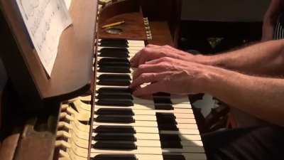 Tubular Bells by Mike Oldfield played on a church organ. It's better known by its colloquial name "The Exorcist theme"