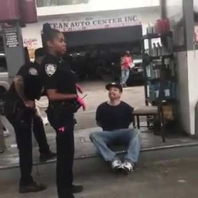 This guy trying to offend the police officer by repeatedly calling her the n word