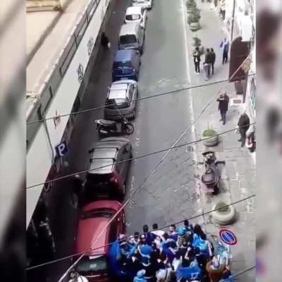 Two opposing football team fans charge at each other!