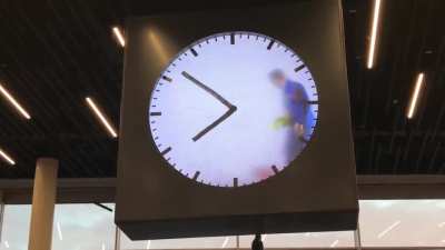 This human operated clock at Schiphol Airport