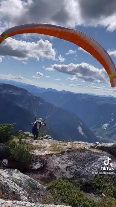 Helping a paraglider while on a hike