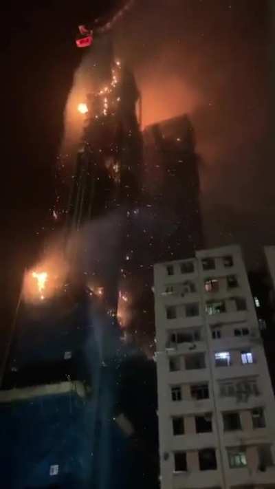 Under construction skyscraper on fire in Hong Kong