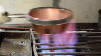 The practice of "tinning" copper/brass vessels. This is done to make the insides of the vessel inert.