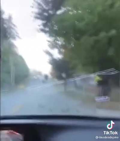 Truck trailer opens up on a hill and dumps steel balls all over the place