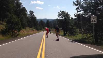 Two rookie friend decided to long board down a 2mile road, only to get so far