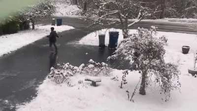 Person slides all the way down his driveway without falling