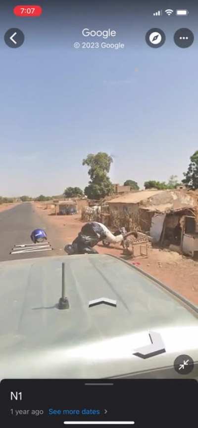 Motorcyclist makes a uturn in front of the Google Streetview car and causes a crash.