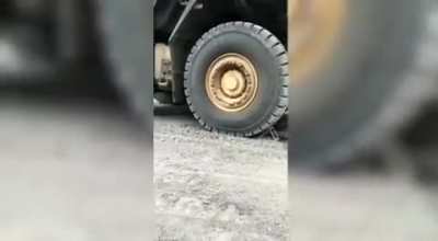 Haul truck accidentally runs over the car of the technicians who came to fix its air conditioner (no injuries)