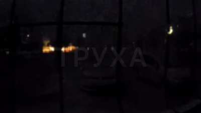 Ukrainian Video from front doorbell cam last night shows shelling that looks like a lightning storm until a neighbors car his struck with a round.