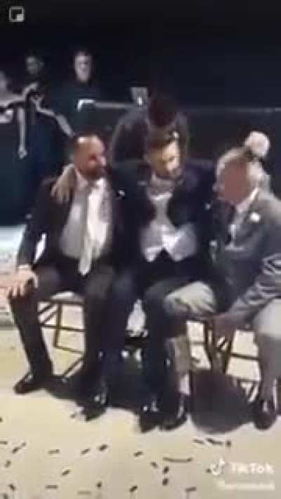 Groomsmen help wheelchair-bound groom have his first dance with bride in heart-warming video